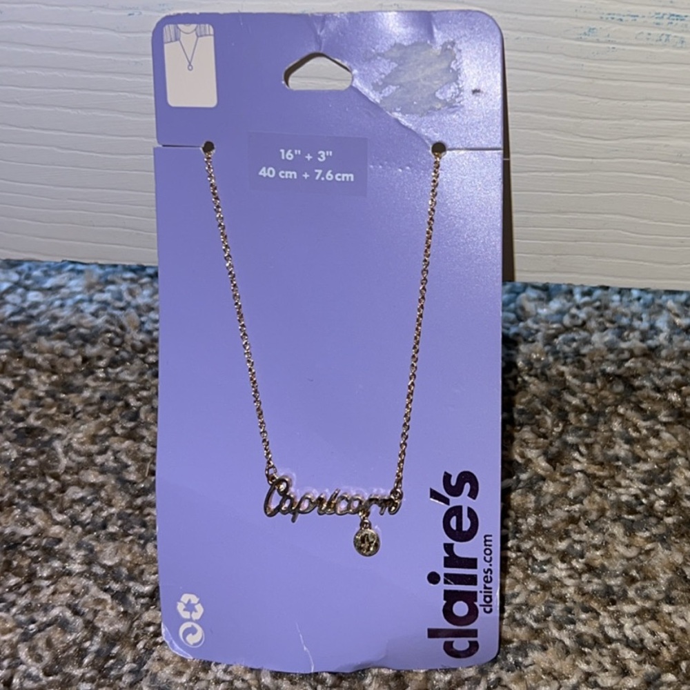 Claire’s Gold Capricorn necklace